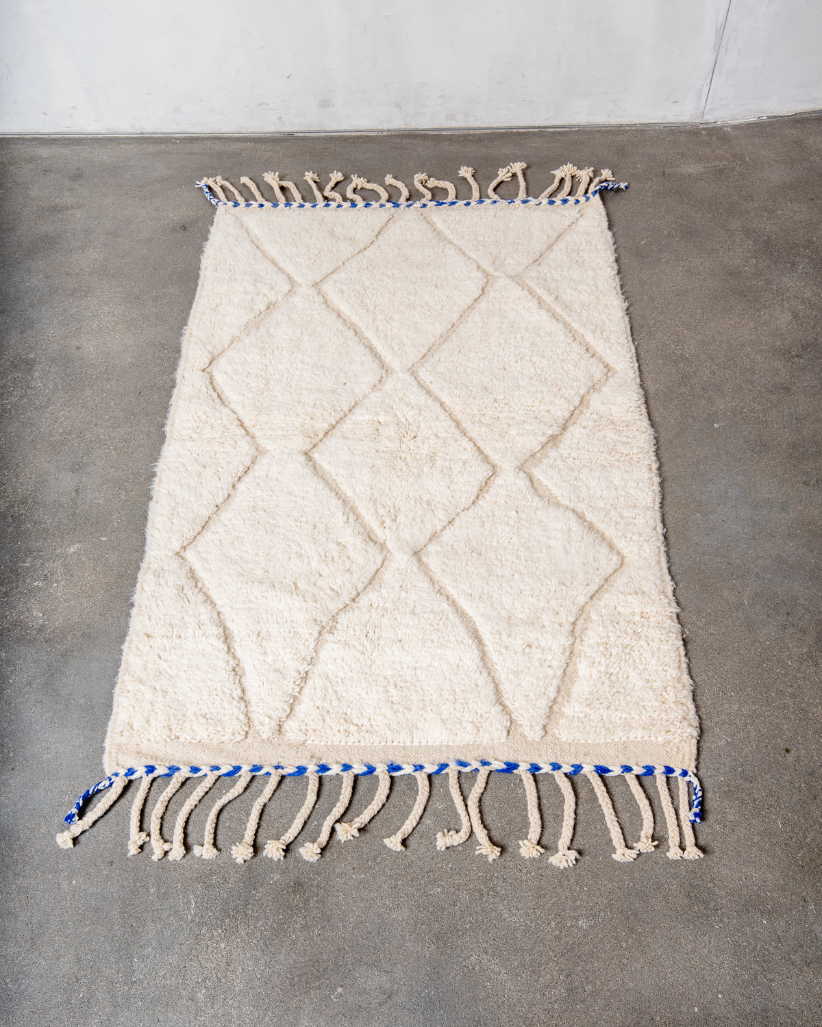 Modern, designer, handcrafted Berber rug from Morocco. Beniourain carpet with minimalist design, natural wool pile and a fluffy texture.